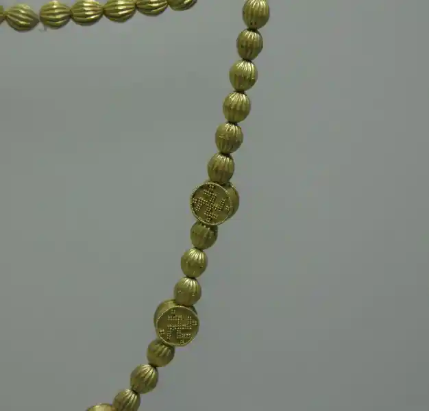 A prechristian gold necklace that looks like a rosary